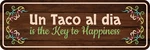 Standard Plus Un Taco Dia Is The Key To Happiness Door Wall Sign. Fixed Price $14.99.